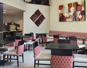 Dining area perfect for coworking at Holiday Inn Express & Suites Naples Downtown - 5th Avenue.