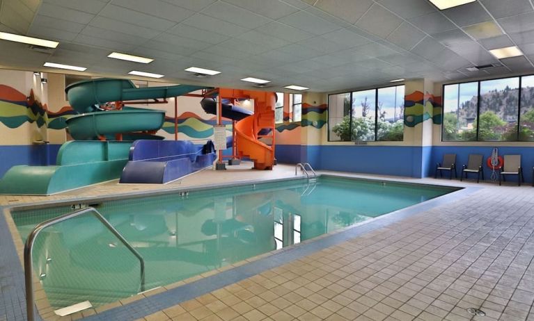 Interior pool with water slides at Kanata Kelowna And Conference Centre. 