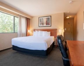 Bright and spacious day use room with work desk at Kanata Kelowna And Conference Centre.