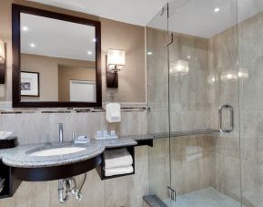 Guest bathroom with shower at Holiday Inn Peterborough-Waterfront.