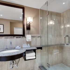 Guest bathroom with shower at Holiday Inn Peterborough-Waterfront.