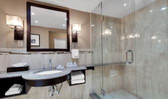 Guest bathroom with shower at Holiday Inn Peterborough-Waterfront.