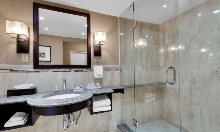 Guest bathroom with shower at Holiday Inn Peterborough-Waterfront.