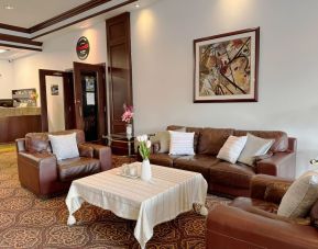 Comfortable lobby lounge at Divya Sutra Plaza & Conference Centre.