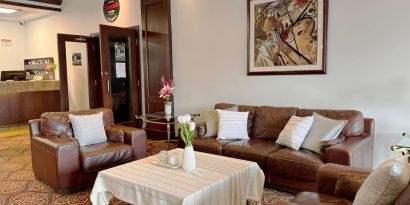 Comfortable lobby lounge at Divya Sutra Plaza & Conference Centre.