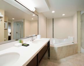 Suite's guest bathroom with hot tub at Best Western Plus Winnipeg Airport.