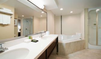 Suite's guest bathroom with hot tub at Best Western Plus Winnipeg Airport.