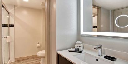 Guest bathroom with shower and free toiletries at The Park Hotel London.