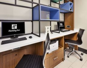 Business center with computers, printer and ergonomic chairs at Holiday Inn St. John's Conference Centre.