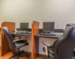 Business center with computers, printer and ergonomic chairs at Quality Inn Hotel Medicine Hat.