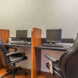 Business center with computers, printer and ergonomic chairs at Quality Inn Hotel Medicine Hat.