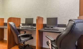 Business center with computers, printer and ergonomic chairs at Quality Inn Hotel Medicine Hat.