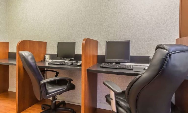 Business center with computers, printer and ergonomic chairs at Quality Inn Hotel Medicine Hat.