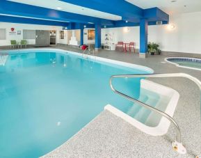 Indoor heated pool with lounge chairs at Quality Inn Hotel Medicine Hat.