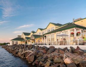 Beautiful hotel terrace with dining area at Rodd Miramichi River.