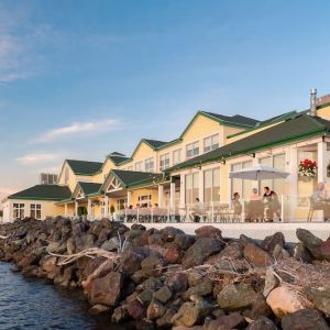 Beautiful hotel terrace with dining area at Rodd Miramichi River.