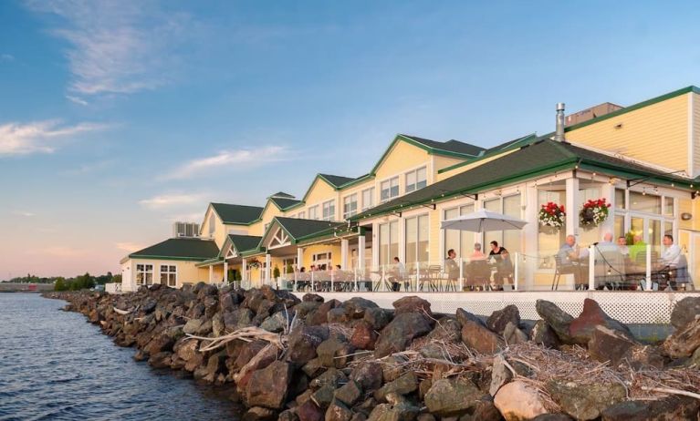 Beautiful hotel terrace with dining area at Rodd Miramichi River.