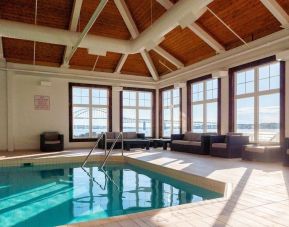 Indoor heated pool with lounge sitting at Rodd Miramichi River.