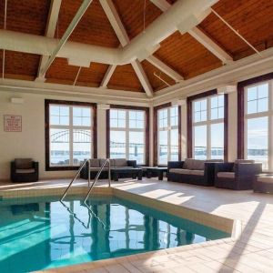 Indoor heated pool with lounge sitting at Rodd Miramichi River.