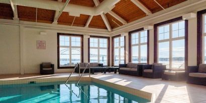 Indoor heated pool with lounge sitting at Rodd Miramichi River.