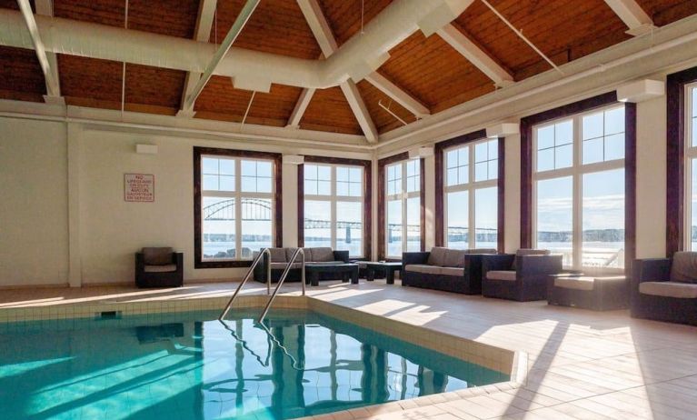 Indoor heated pool with lounge sitting at Rodd Miramichi River.