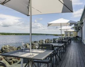 Terrace sitting area with beautiful view at Rodd Miramichi River.