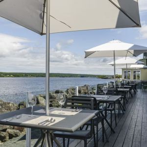 Terrace sitting area with beautiful view at Rodd Miramichi River.