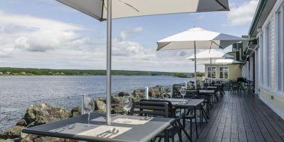 Terrace sitting area with beautiful view at Rodd Miramichi River.