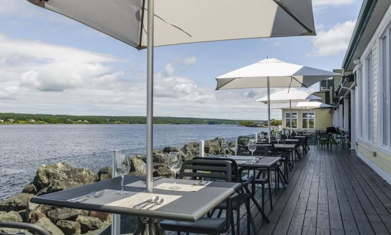 Terrace sitting area with beautiful view at Rodd Miramichi River.