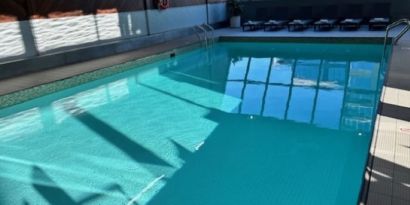 Relaxing indoor pool with lounge chairs at Atlantica Hotel Halifax.