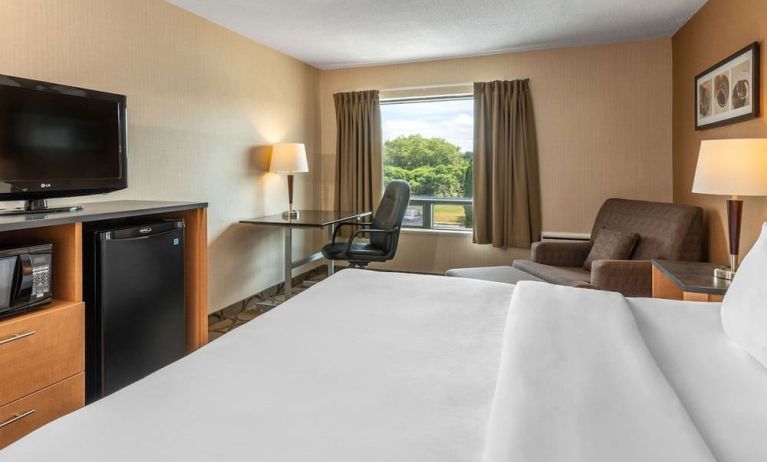 Standard day use room with TV, work desk and sofa at Comfort Inn Pembroke.