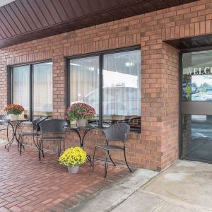 Hotel entrance with sitting area at Comfort Inn Pembroke.