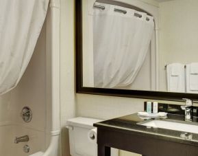 Guest bathroom with tub and free toiletries at Comfort Inn Pembroke.