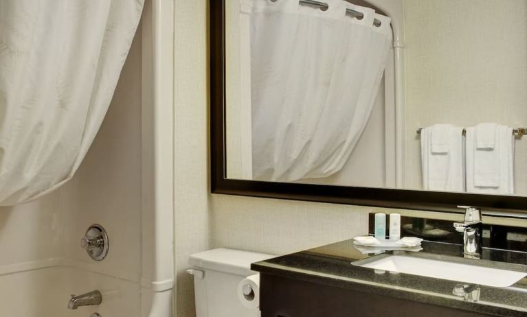 Guest bathroom with tub and free toiletries at Comfort Inn Pembroke.