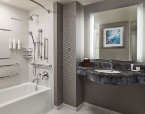 Guest bathroom with shower and tub at Crystal Gateway Marriott.