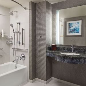 Guest bathroom with shower and tub at Crystal Gateway Marriott.