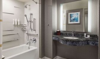 Guest bathroom with shower and tub at Crystal Gateway Marriott.