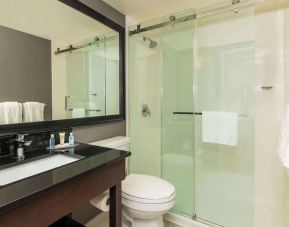 Guest bathroom with shower and free toiletries at Comfort Inn Gatineau.