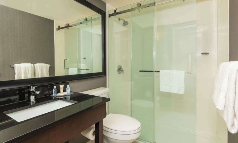 Guest bathroom with shower and free toiletries at Comfort Inn Gatineau.