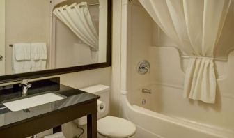 Guest bathroom with tub at Comfort Inn Belleville.