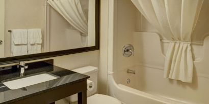 Guest bathroom with tub at Comfort Inn Belleville.