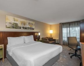 Standard day use room with work desk and sofa at Comfort Inn Fredericton.