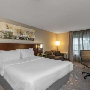 Standard day use room with work desk and sofa at Comfort Inn Fredericton.