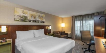 Standard day use room with work desk and sofa at Comfort Inn Fredericton.