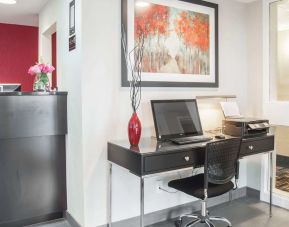 Business center with computer, printer and ergonomic chair at Comfort Inn Fredericton.