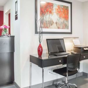 Business center with computer, printer and ergonomic chair at Comfort Inn Fredericton.