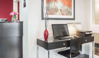 Business center with computer, printer and ergonomic chair at Comfort Inn Fredericton.