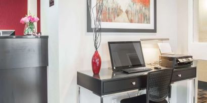 Business center with computer, printer and ergonomic chair at Comfort Inn Fredericton.