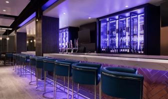 Hotel bar with lounge seating at Embassy Suites By Hilton Toronto Airport.