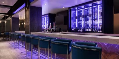 Hotel bar with lounge seating at Embassy Suites By Hilton Toronto Airport.